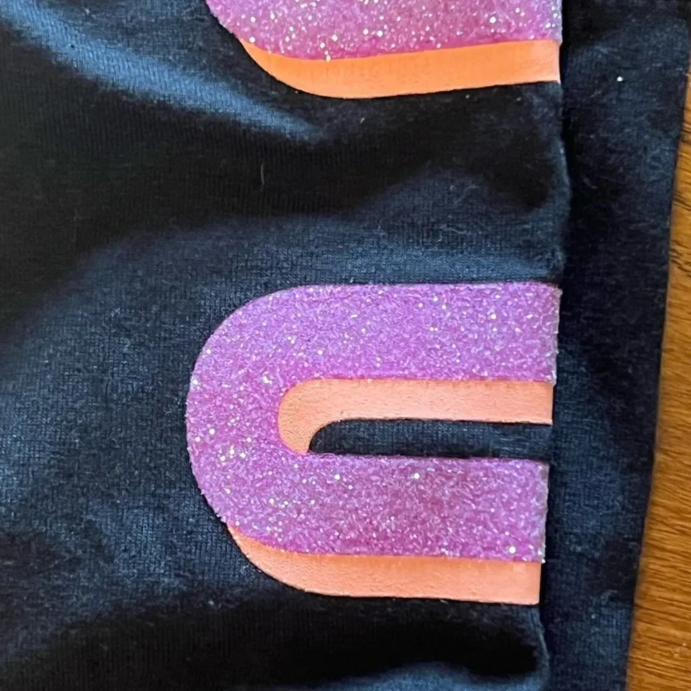 Justice (NWT) black leggings with purple & orange glitter letters size L 10/12